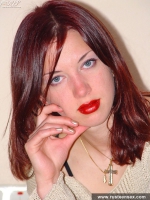 Teen brunette undresses and poses