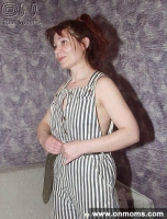 Mature brunette changes clothes