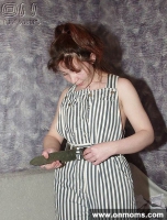 Mature brunette changes clothes