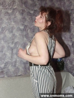 Mature brunette changes clothes