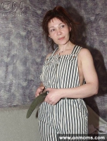 Mature brunette changes clothes