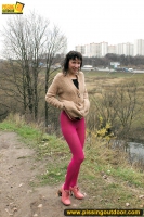 Mom pisses outdoor on the road