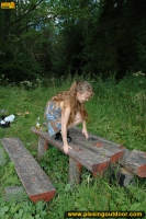 Outdoor pissing on a wooden bench