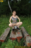 Outdoor pissing on a wooden bench