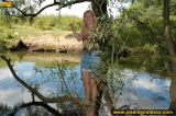 Teen blonde pissing in the lake