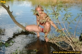 Teen blonde pissing in the lake