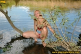 Teen blonde pissing in the lake