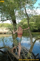 Teen blonde pissing in the lake