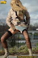 Teen blonde pissing outdoor near the highway