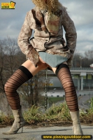 Teen blonde pissing outdoor near the highway
