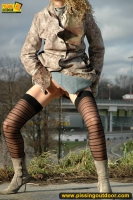 Teen blonde pissing outdoor near the highway