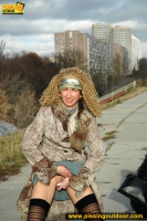 Teen blonde pissing outdoor near the highway