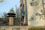 MILF blonde pissing outdoot on the painted pedestal