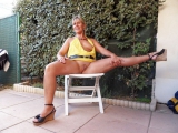 Outdoors spreading on the white folding chair