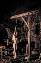 Nude teen in medieval torture