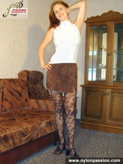 Pantyhosed teen girl shows nyloned legs - N