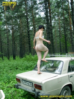 Brunette pissing in a forest - N