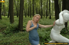 Pissing outdoor on a statue - N