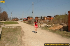 Pissing outdoor in a village street - N