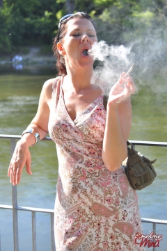 Brunette babe smoking at the riverside - N