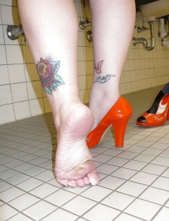 April washes her feet in the ladys room - N