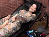 Tiger Lilly gets a forehead tattoo while nude