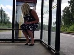 HannaTransa Chastity Crossdresser outdoors at train station.