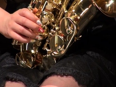 Kyoka Makimura plays the saxophone and shows off her hot