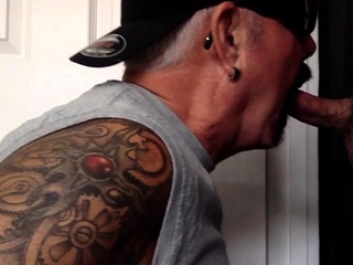 Gloryhole tattooed gaydaddy sucks cock