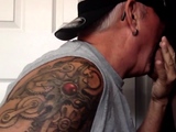 Inked gaydaddy slut sucks in gloryhole