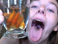 Becky feeding on fish in the shower - Vore Giantess